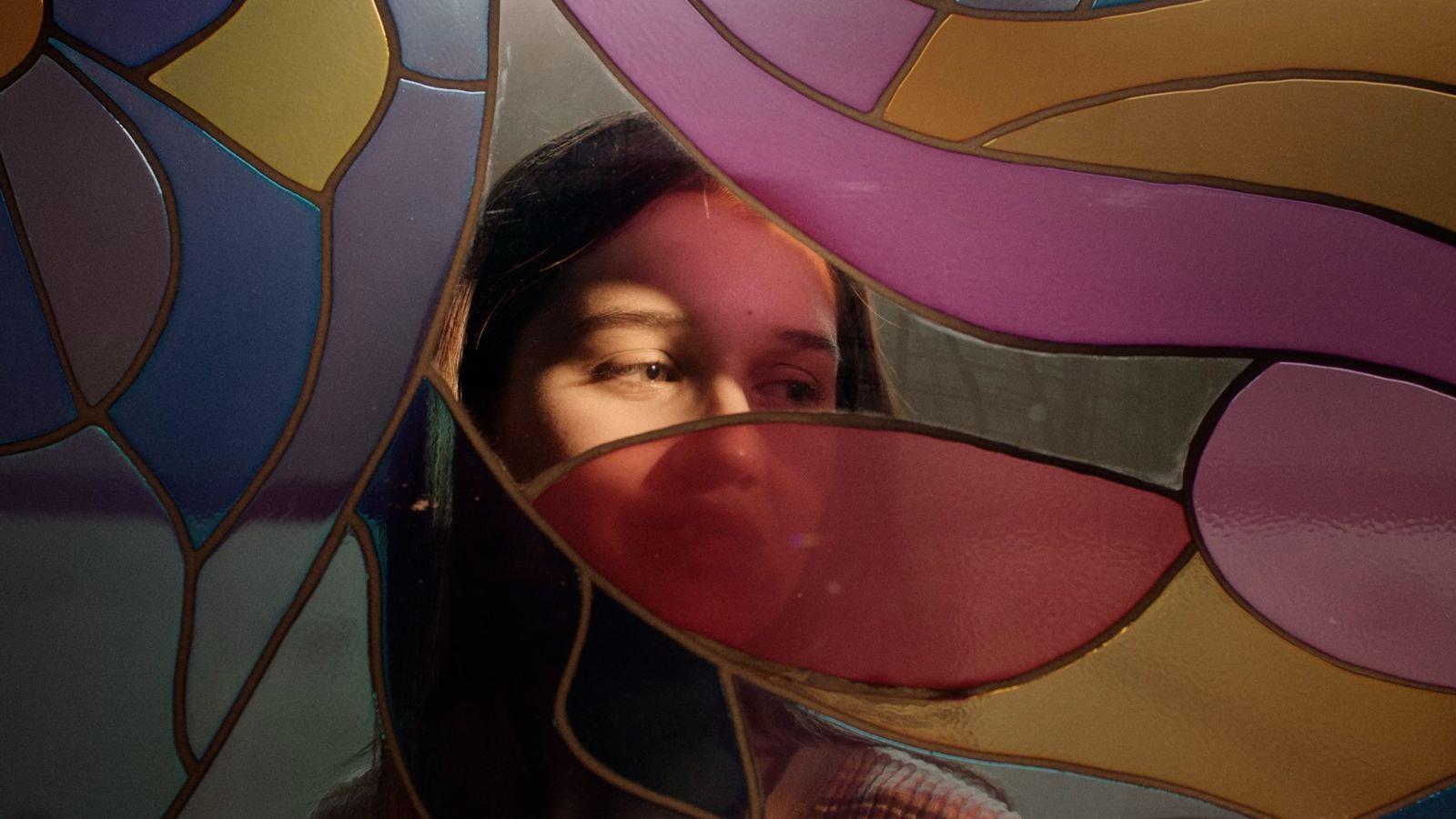 Cracks run through this multicolored glass 2025 movie scene
