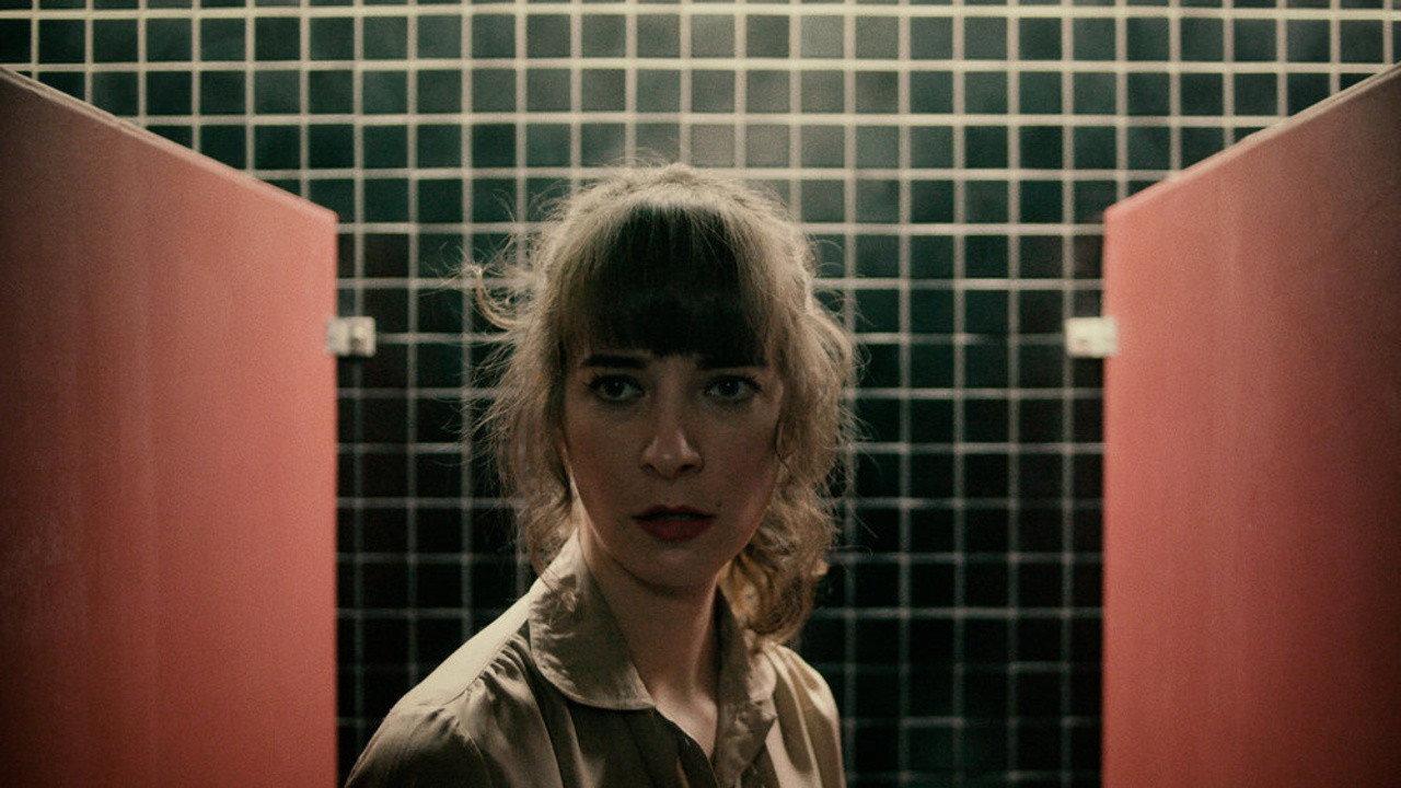 Woman in Stall 2018 movie scene