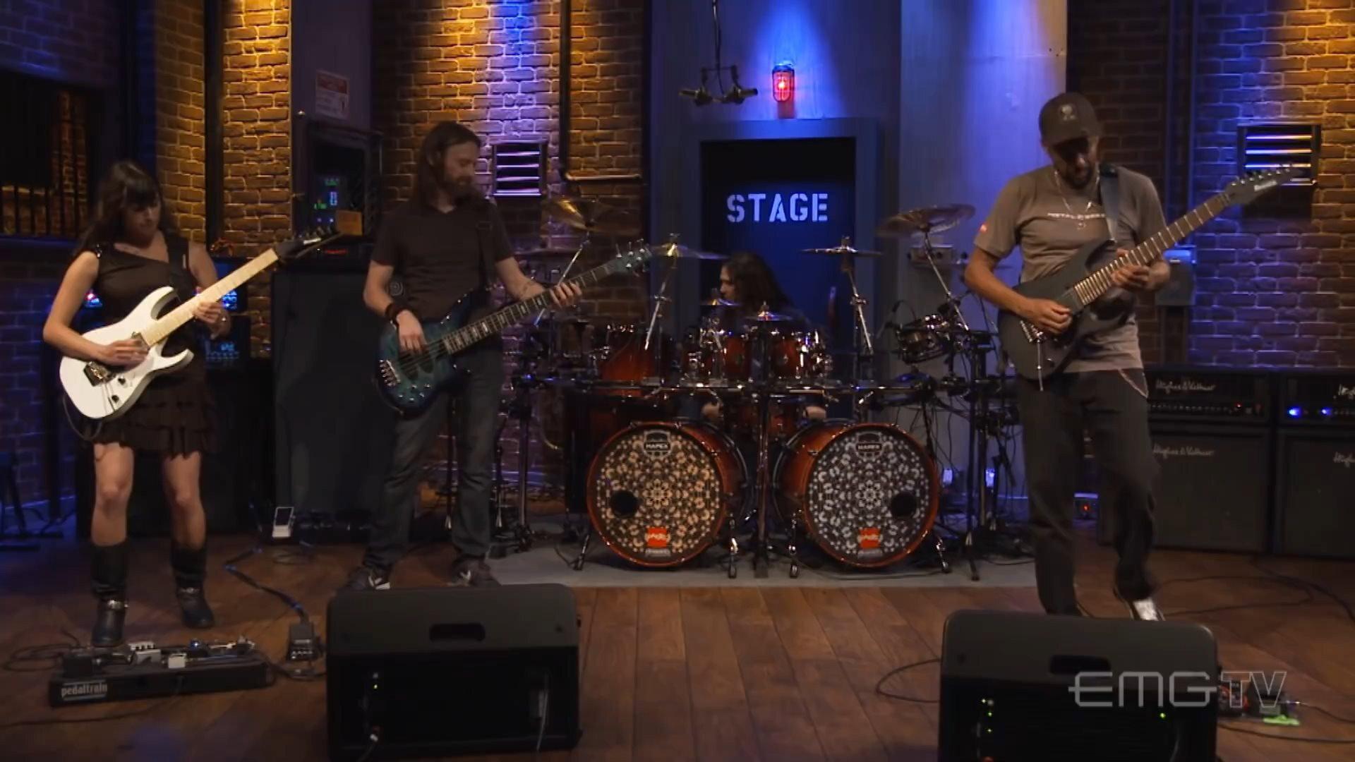 Tony MacAlpine and band perform "Tears of Sahara" on EMGtv movie scene