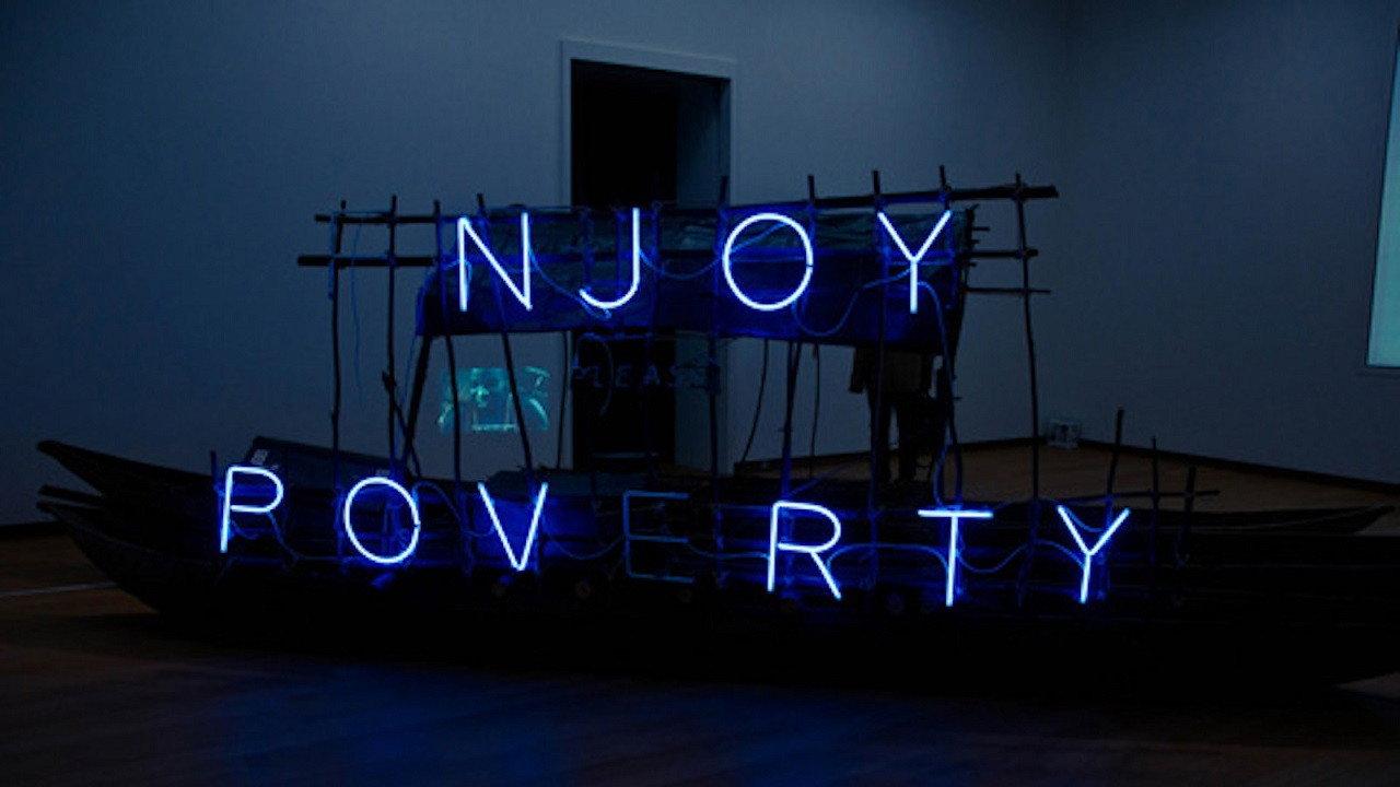 Enjoy Poverty 2009 movie scene