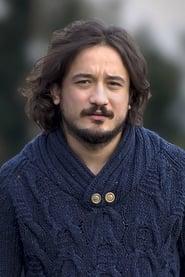 Cenk Çelik as Muro in İllegal Hayatlar: Meclis 2024
