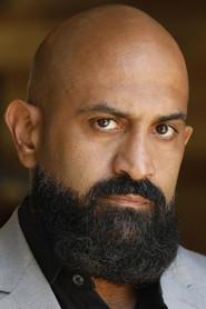 Mike Eshaq as Ahmad the Security Guard in Salvation Boulevard 2011