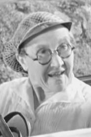 Valentine Camax as Old lady on the phone (uncredited) in Anne-Marie 1936