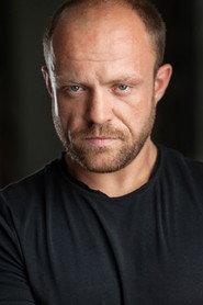Vladimir Raiman as Man In Black in Dying for a Family 2022