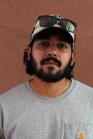 Darius Caceres as Background in Just Three Words 2026