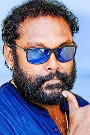 Dharshan Dharmaraj as The Official in Marine Drive 2024