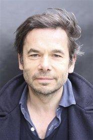 Loïc Houdré as Monsieur Martini in All the Gods in the Sky 2019