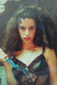 Laura Giglio as The Newscaster in Psycho Sisters 1994