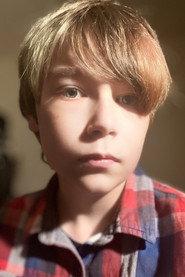 Xander Britton as Alan Cooper in Bloodied Lens 2027