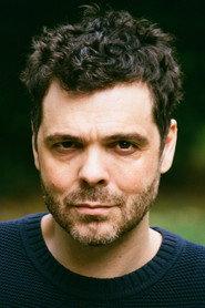 Justin Avoth as Ponytail Man in Bring Me the Head of Mavis Davis 1997
