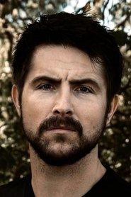 Scott James George as Hooded Man in Killer Whale 2026