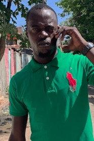 Omarley Dennie as Self - PMI Member in Last Street 2019