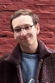 Alex Celico as Background in Just Three Words 2026