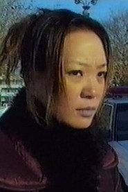 Jin Zi as Woman in black in Thomas Mao 2010