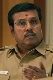 Kalaimamani Dr.S. Amudhakumar as Commissioner Kumaravelu in Aadharam
