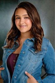 Ellie Mae Louise Smith as Little girl in the church / family in Glass Walls 2022