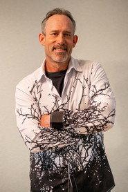 Jack Trout as Trippy Smiling Guy in The Lemurian Candidate 2025