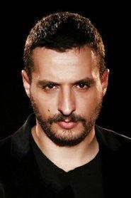 Latif Koru as Barmen in In Good Hands 2022