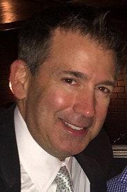 John V. Barbieri as News Anchor in Souvenirs 2021