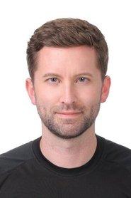 Derek Chouinard as Reporter in While They Watched 2015