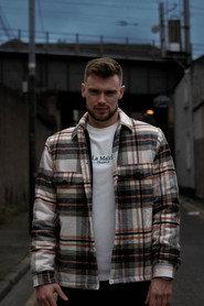 Robbie Collins as Daniel in Never Let Me Go 2022
