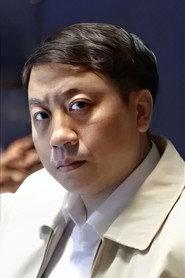 袁国纲 as 教授 in Bunshinsaba vs Sadako 2016