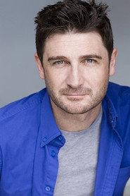 Grae Burton as Father James in God’s Favourites Fall Hardest 
