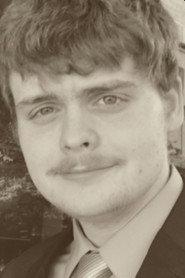 Collin Quirk as Phil Legot in Golden Figure 2023