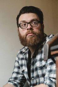 Travis McElroy as Self / Magnus Burnsides / Jingle King in The Candlenights 2021 Special 2021