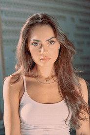 Flaka Latifi as Qe in The Hill Where Lionesses Roar 2022