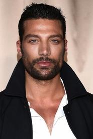 Simone Susinna as Toyboy in Mrs. Christmas 2025
