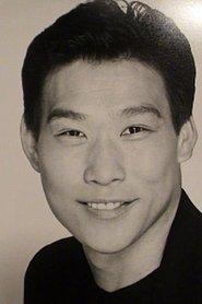 Stuart Quan as Henry's 1st Blackbelt in Angel Town 1990