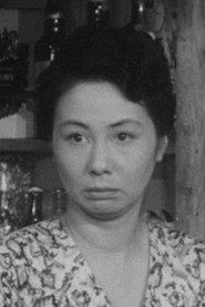 Kiyomi Mizunoya as Aki Momoyama in New Third Class Executive: Fortune Teller 1960