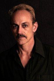 Ben Lokey as Lt. Jim Holloway in American Nobody 2024