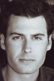 Josh Stone as Bush in Attack of the Killer Tomatoes: Organic Intelligence 2026