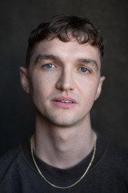 Will Taylor as Crowd VO (voice) in Village Idiot 2026
