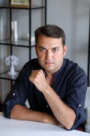 Taras Kuzmin as Andrey's Father in Little Brownie Kuzya 2024