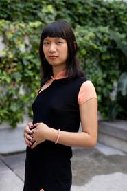 Julie Zhen as Wang in Chinas 2023