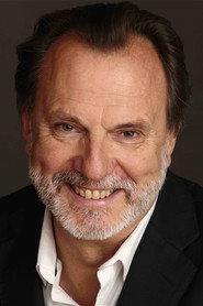 Philippe Roullier as Professor Michel Garron, a neighbor in À vos souhaits 2018