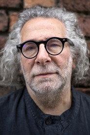 Kevin Godley as vocals on "Old Wild Men" and "BeautifulLoser.com", percussion on "Rubber Bullets" in 10cc - Clever Clogs. Live in Concert 2007