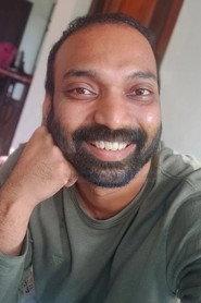 Anuroop P as Dharman in Communist Pacha Adhava Appa 2025