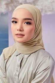 Qasrina Karim as Sharifah in Kongsi Raya 2022