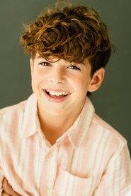 Lewis Cummins as Young Jake in The Housewives of the North Pole 2021