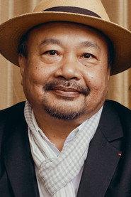 Rithy Panh as Monsieur Khieu in Holy Lola 2004