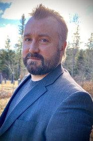 Elliott Van Dusen as Paranormal Research Specialist in Ghost Island 2025