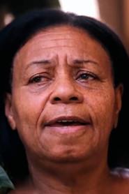 Dona Maria das Graças as ex-vizinha de Ramires in To whom it may concern, This inverted life 2024