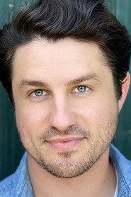 Aaron Mees as Trevor Henderson in Christmas in the Pines 2021