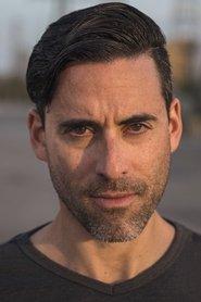 Adam Daniel Mezei as Eric in Isthmus 2021