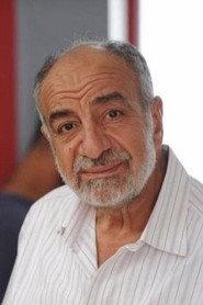 Fawzi Bishara as Burial office employee in Happy Land 2022