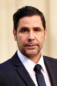 Juan Falcón as Talk Show Host in Nobody Knows I'm Here 2020